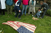 Jeremy John, right, laughs as he acts in an anti-Patriot Act II political theatre with Erik Woodworth outside the Bloomington office of the FBI.
