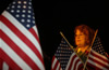 A woman waits on a cold winter morning for a loved one to step off a plane after serving in Iraq with the Indiana National Guard.