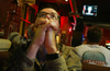 Jason Jancosek watches President George W. Bush announce that American forces have begun action in Iraq during March 2003.