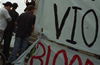 An organizer issues a statement outside the jail where activists are being held after arrested by police during a Critical Mass bicycle ride, Bloomington, Indiana. 2001