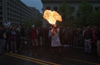 An anti-Globalization protester blows flames while protesting a meeting of the IMF and the World Bank in Washington, D.C. April 16, 2000