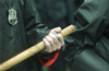 A police officer grips a club during the IMF and World Bank protests Washington D.C. April 16, 2000
