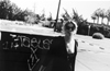 Lindi makes a joke in the parking lot of an abandoned motel near Freeway 99. The edges of the highway used to be littered with the skeletons of business gone bust. 1992